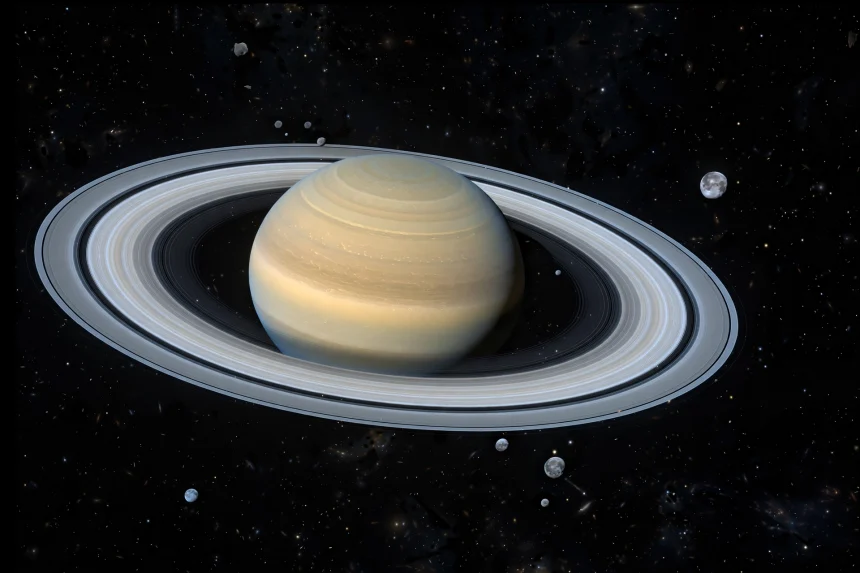 Saturn and its rings surrounded by many small distant moons in deep space
