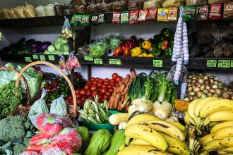 Colourful fresh vegetables arranged at a market stall