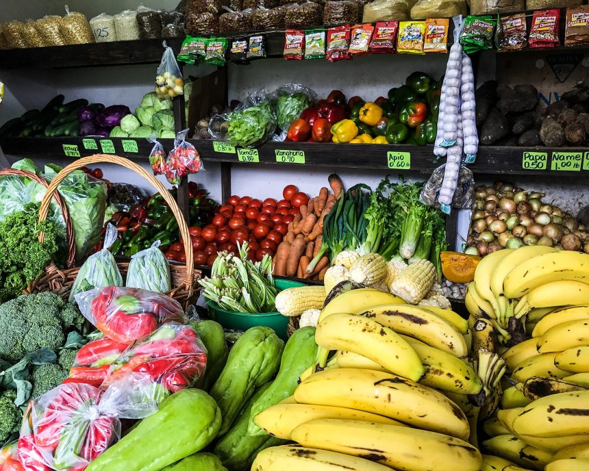 Colourful fresh vegetables arranged at a market stall