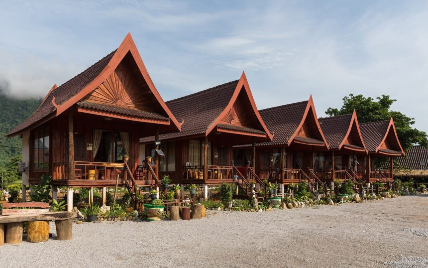 A row of wooden houses raised on stilts with terraces